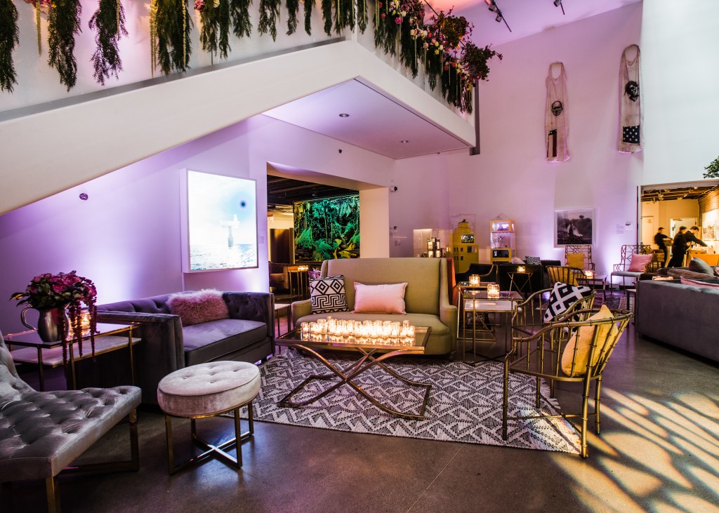 21c Louisville event space set up for an event with furniture, floral arrangements and ambience lighting