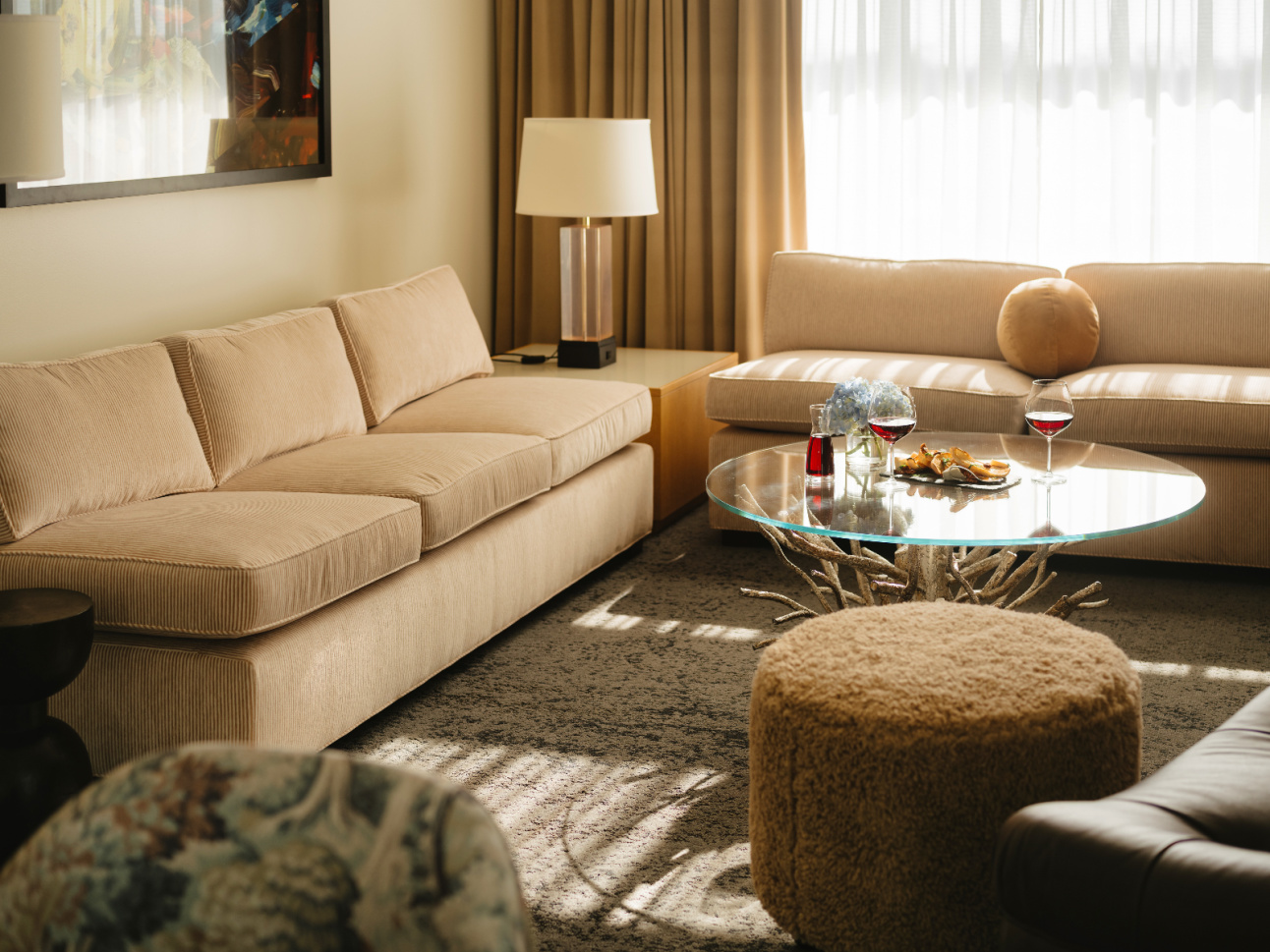 Sitting area with wine and in-room dining in a renovated 21c Suite