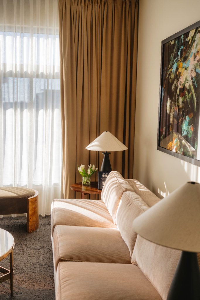 Couch, round table and chairs in Luxury Suite at 21c Bentonville