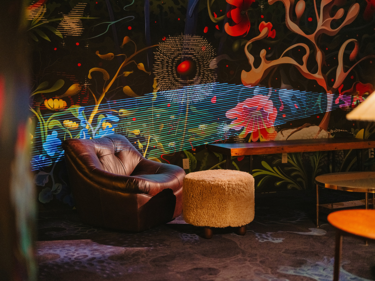 Comfy chair and pouf in Nightwatch renovated at 21c Bentonville