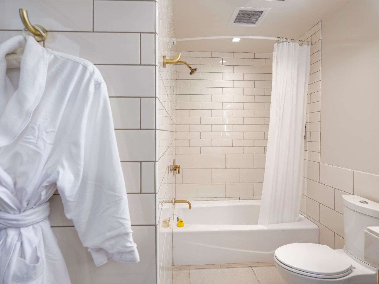 Shower and bathrobe in a Luxury Double Queen renovated at 21c Bentonville