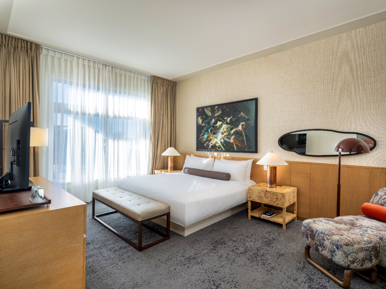 Couch, sitting area, and round table with chairs in Luxury Suite renovated at 21c Bentonville