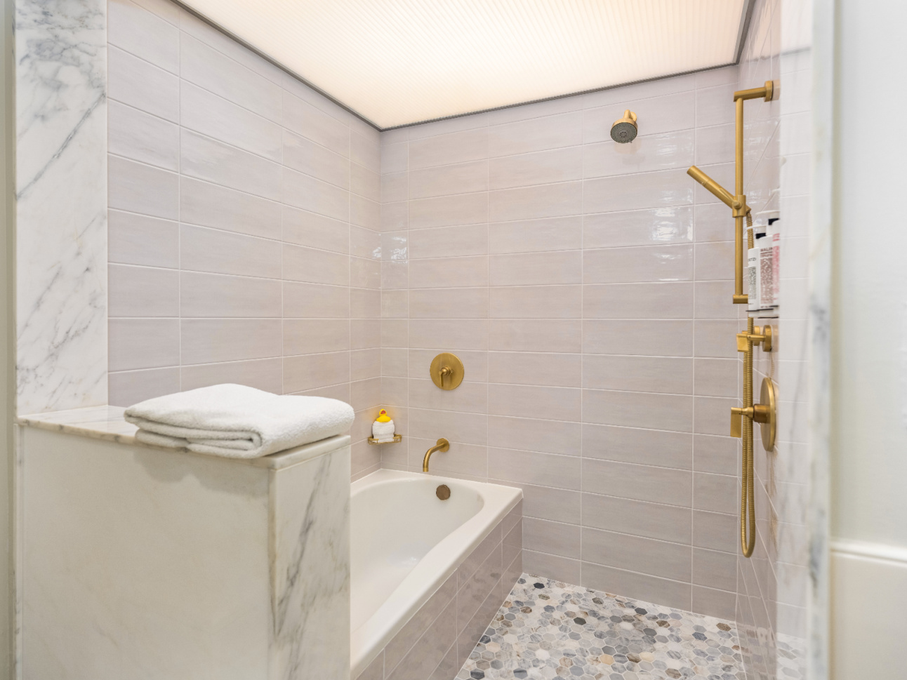 Bathroom shower and tub in Nightwatch renovated at 21c Bentonville
