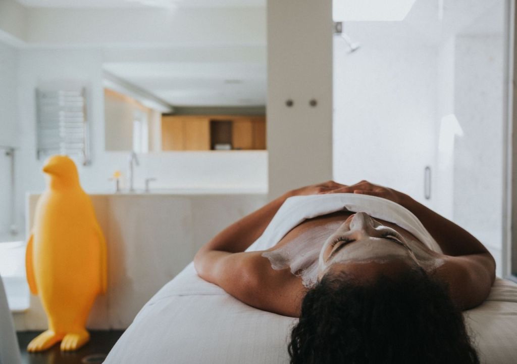 A woman resting on a massage table