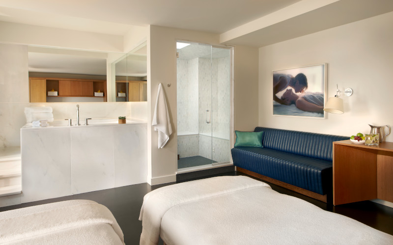 The Spa at 21c treatment room with shower, two spa tables, a couch.