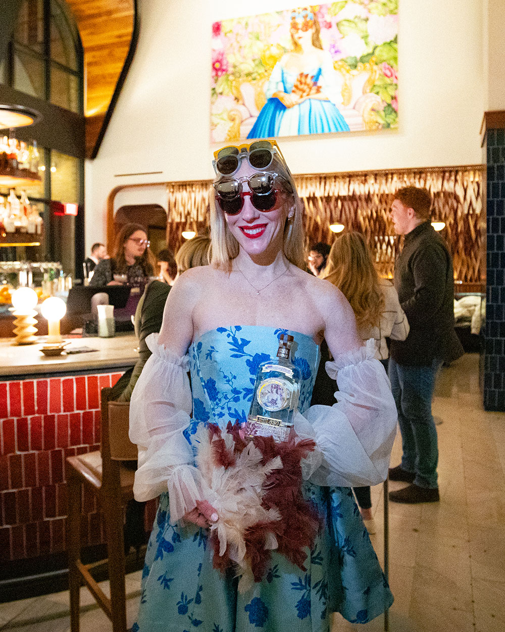 A woman in a blue dress and sunglasses as Carlos Gamez de Francisco’s “Mind Your Manners II”