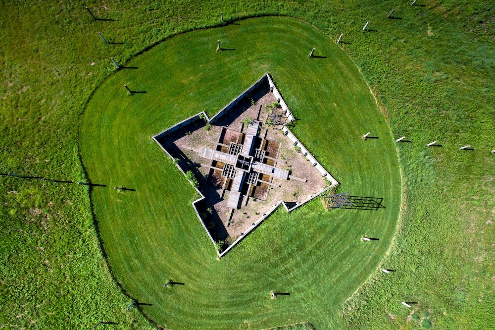 Aerial image of a building on green grass
