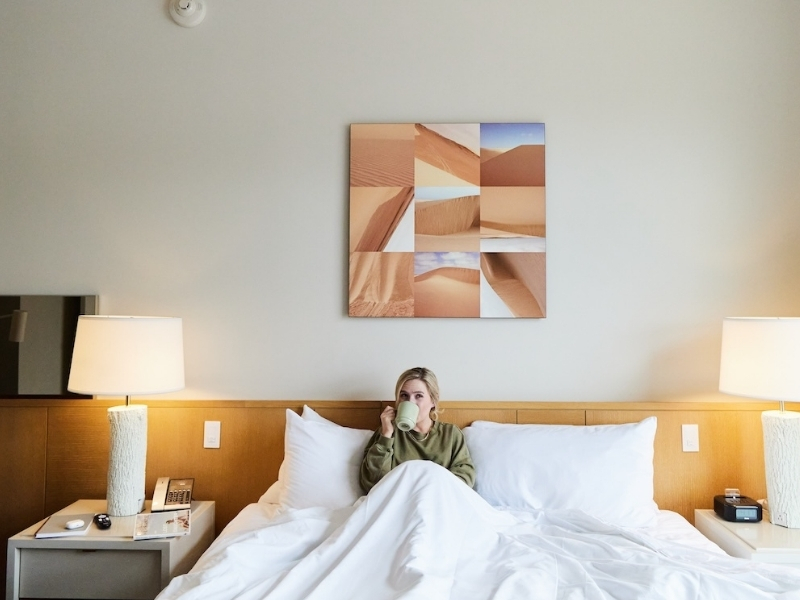 woman in bed drinking coffee