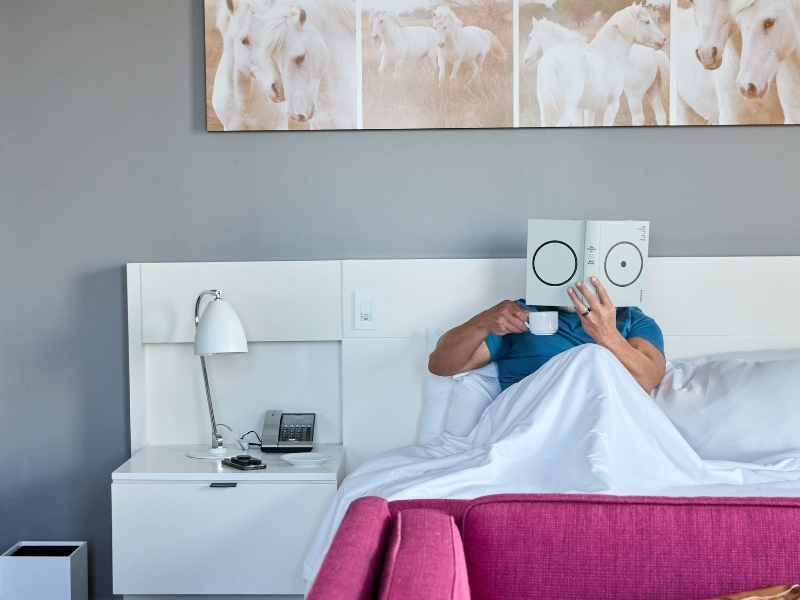 man reading in bed