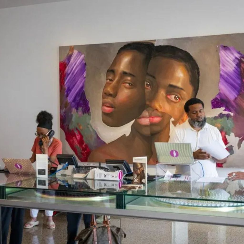 Two front desk attendants at a desk