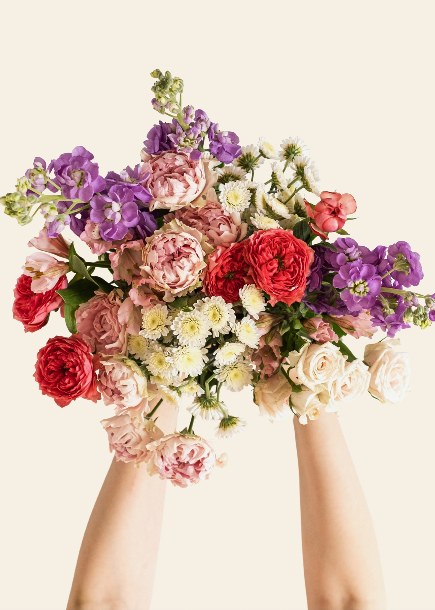 Hands holding flower bouquet