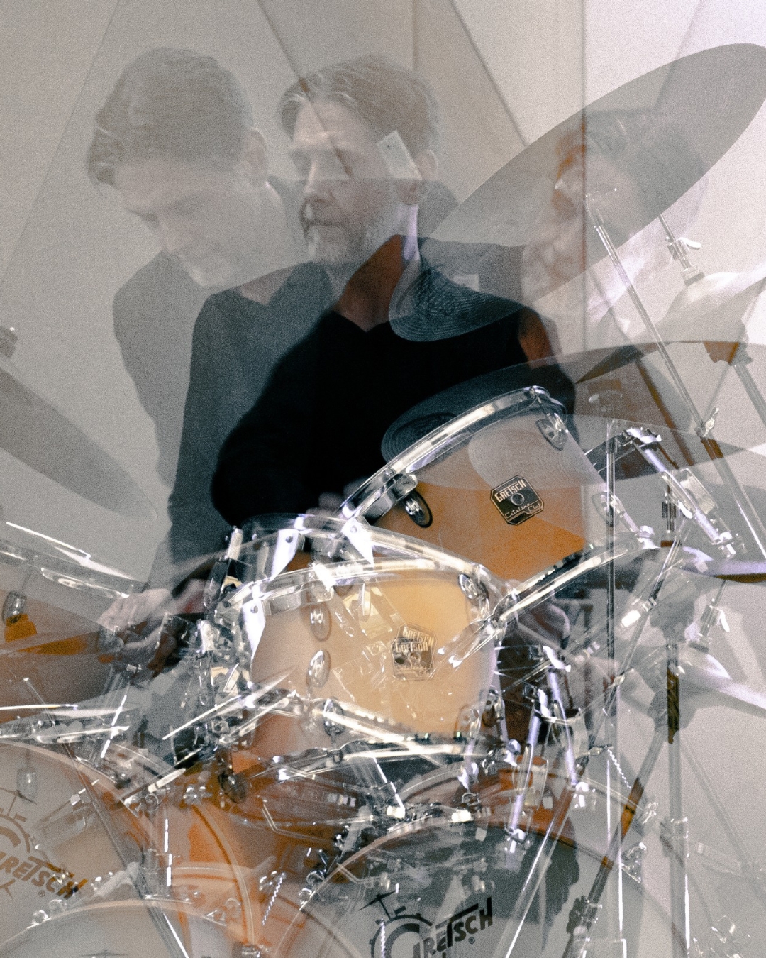 Man playing drums.
