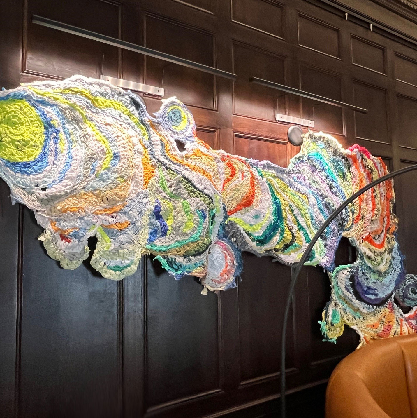 A crochet wall installation made of upcycled materials by artists Hannah March Sanders and Blake Sanders