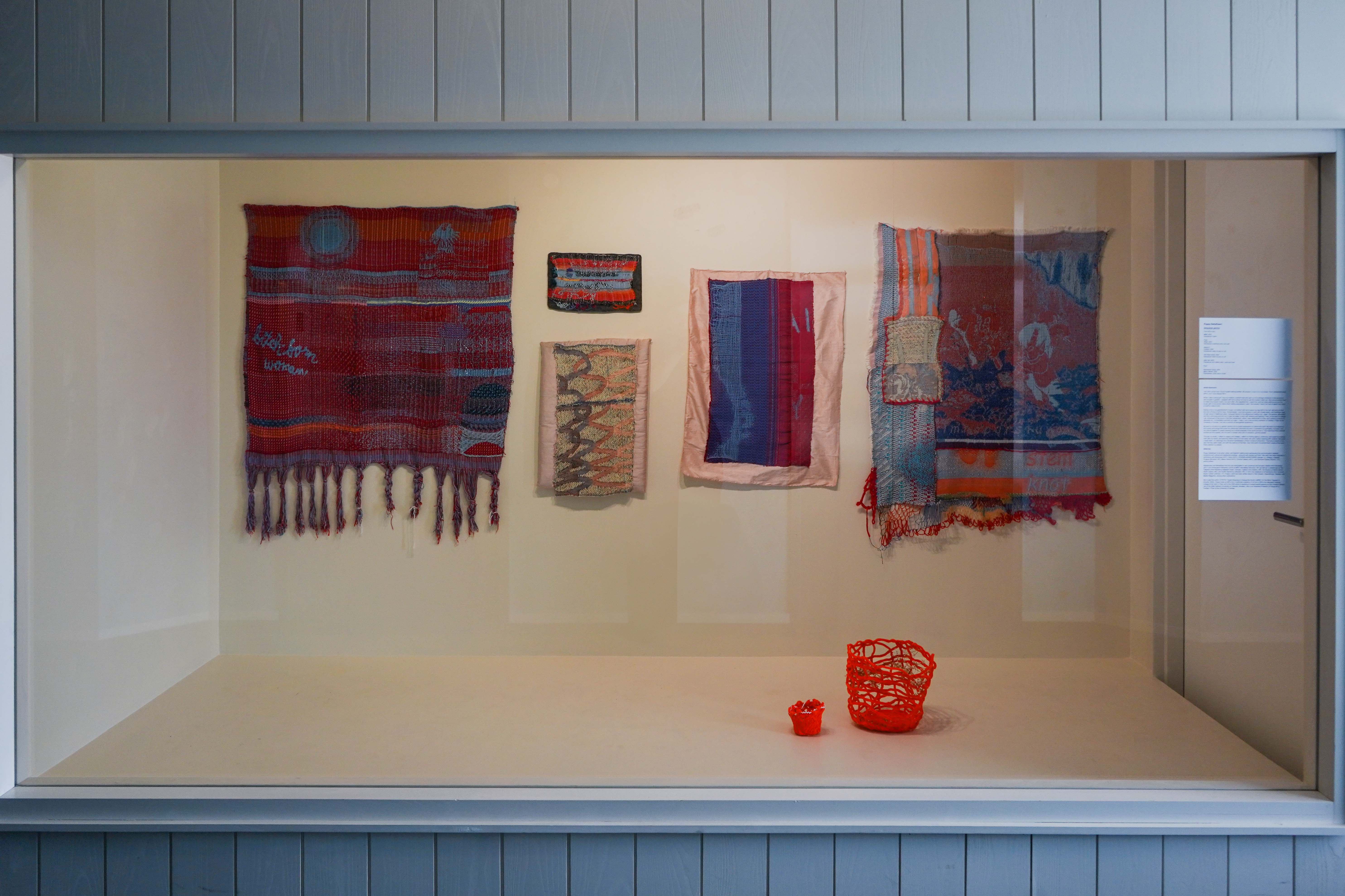 Woven fabrics in a glass case