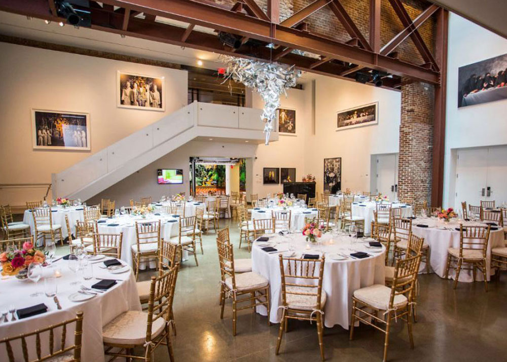 The Atrium in 21c Museum Hotel Louisville set up with tables for a wedding reception