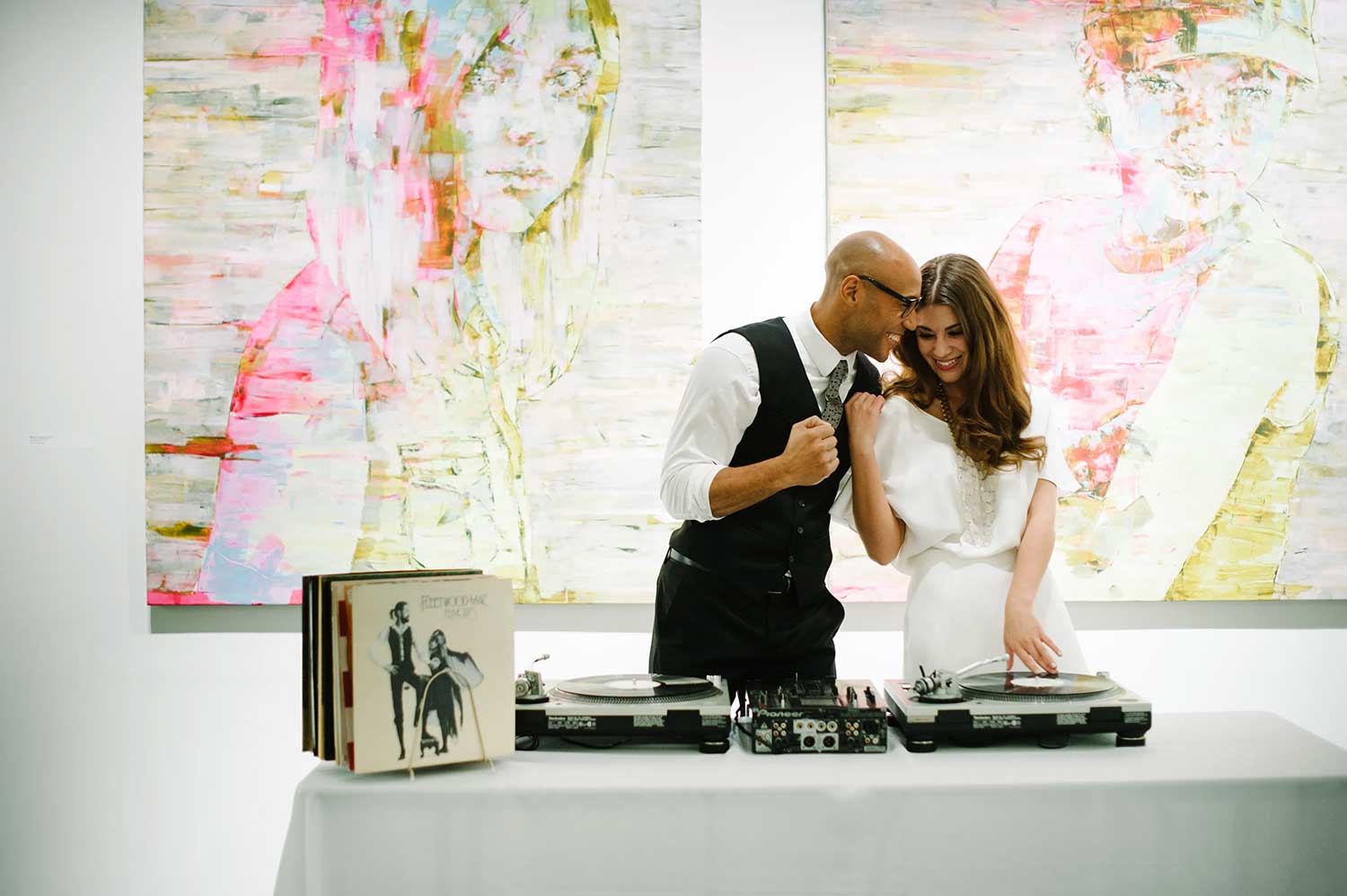 A couple playing records at their wedding at 21c Museum Hotel