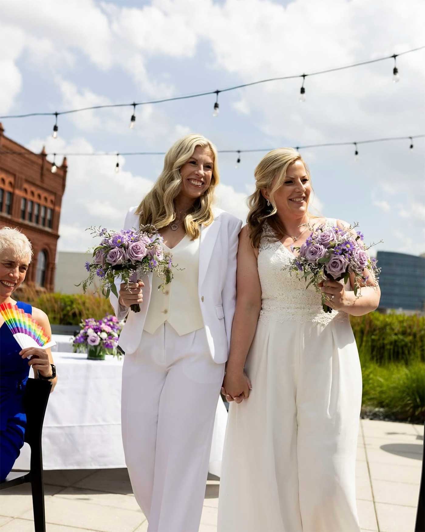 Two brides at their rooftop wedding at 21c Museum Hotel Louisville