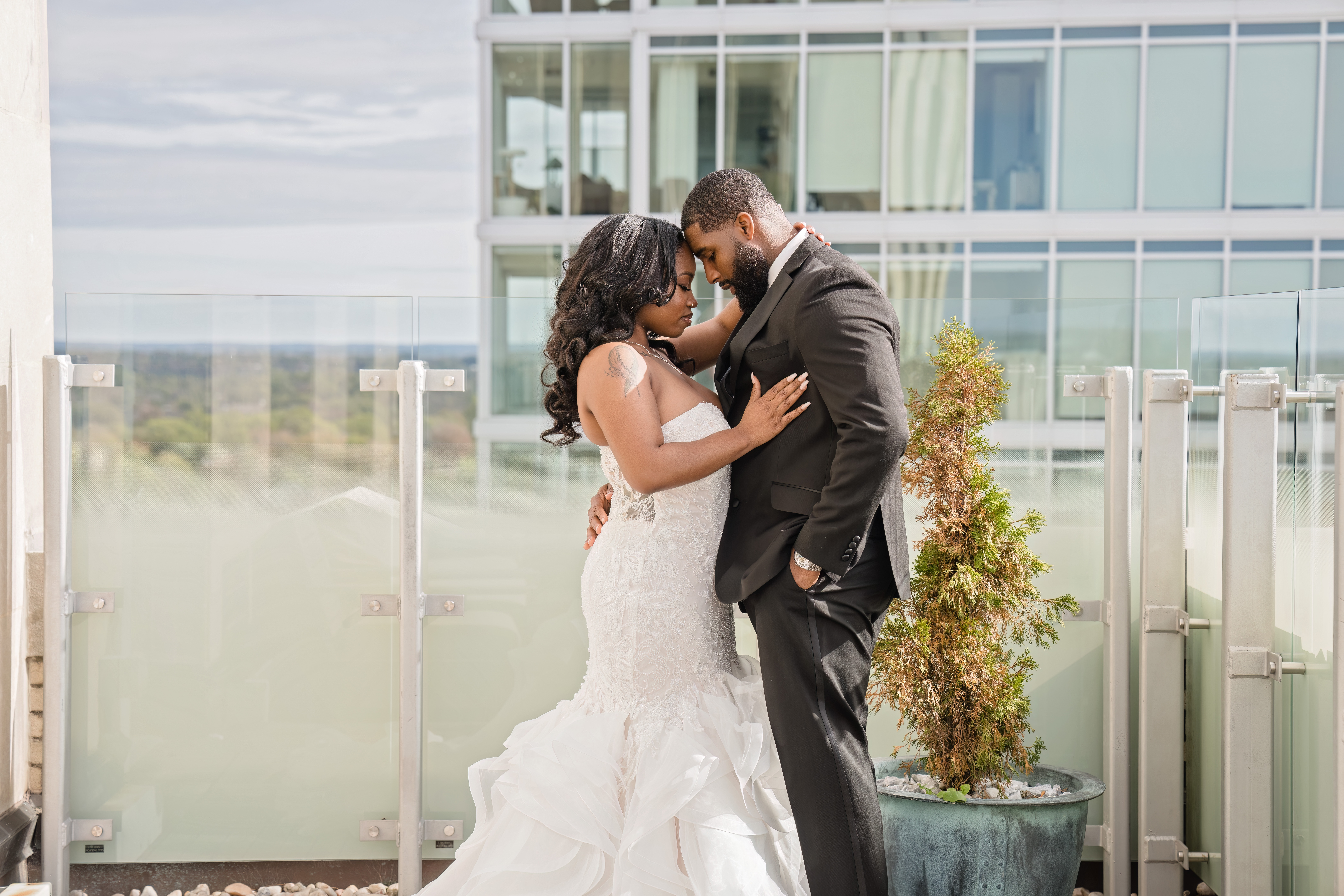 wedding couple at the balcony of the suite 
